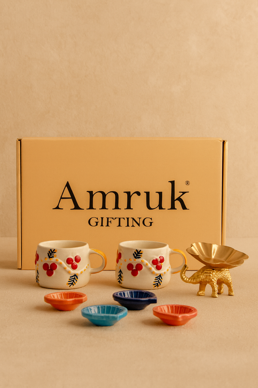 Studio Pottery 7 Piece Diwali Gift Box ( 2 Cups + 4 Diya's +Metal Elephant Tea light Holder + Diwali Card )