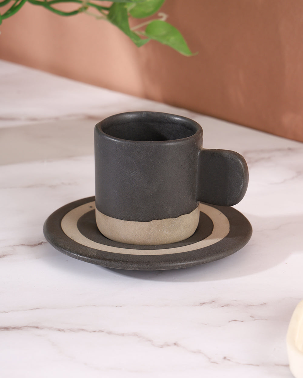 The little black cup with saucer