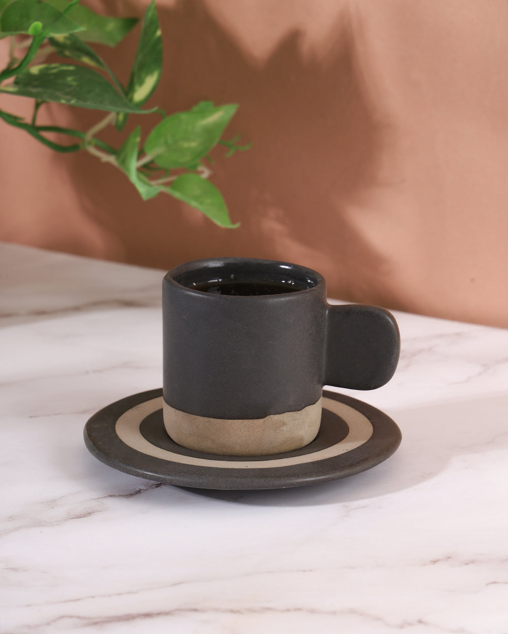 The little black cup with saucer